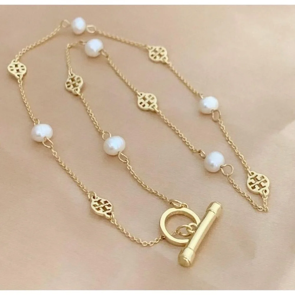 Tory Burch Gold and White Necklace with Textured Discs - Picture 1 of 4